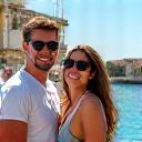 Amelia and Ben Carter posing in a coastal Italian village